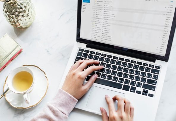 working on laptop and emails